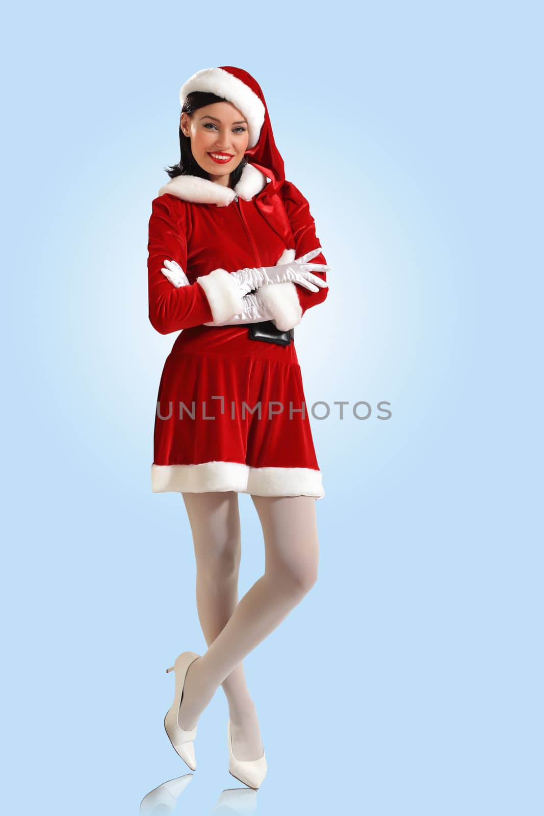 Portrait of beautiful young woman wearing santa claus clothes