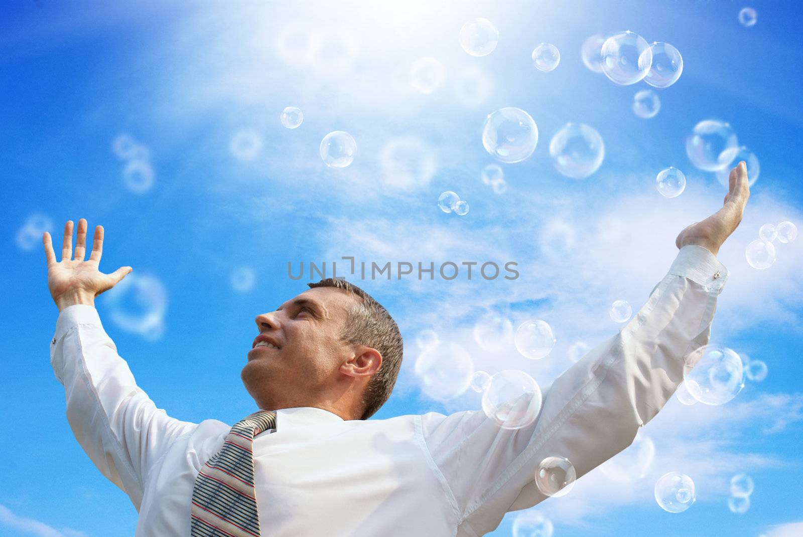 Pink dreams happy businessman on a blue sky by sergey150770SV