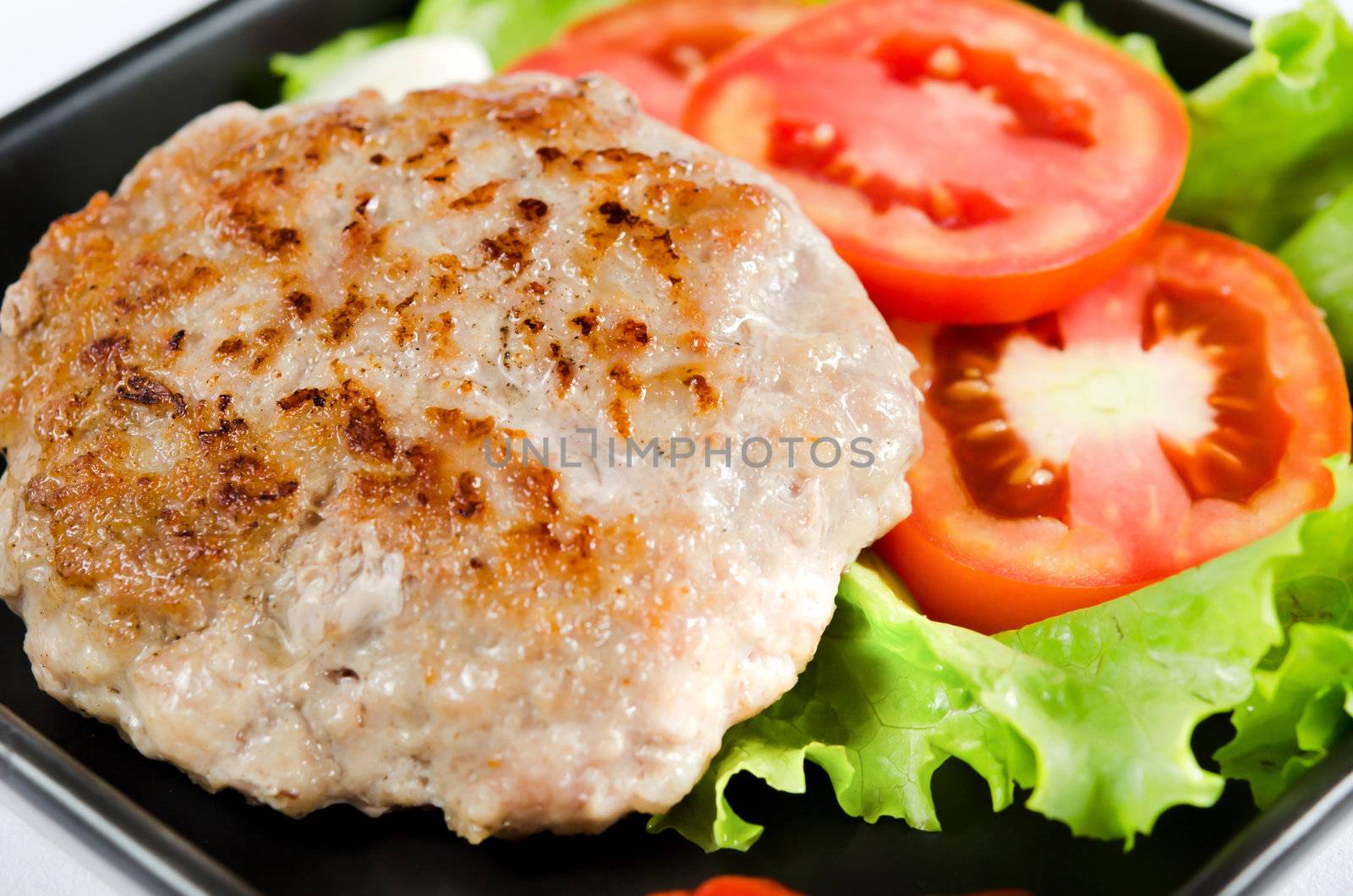 fried pork served with fresh vegetable and tomato sauce
