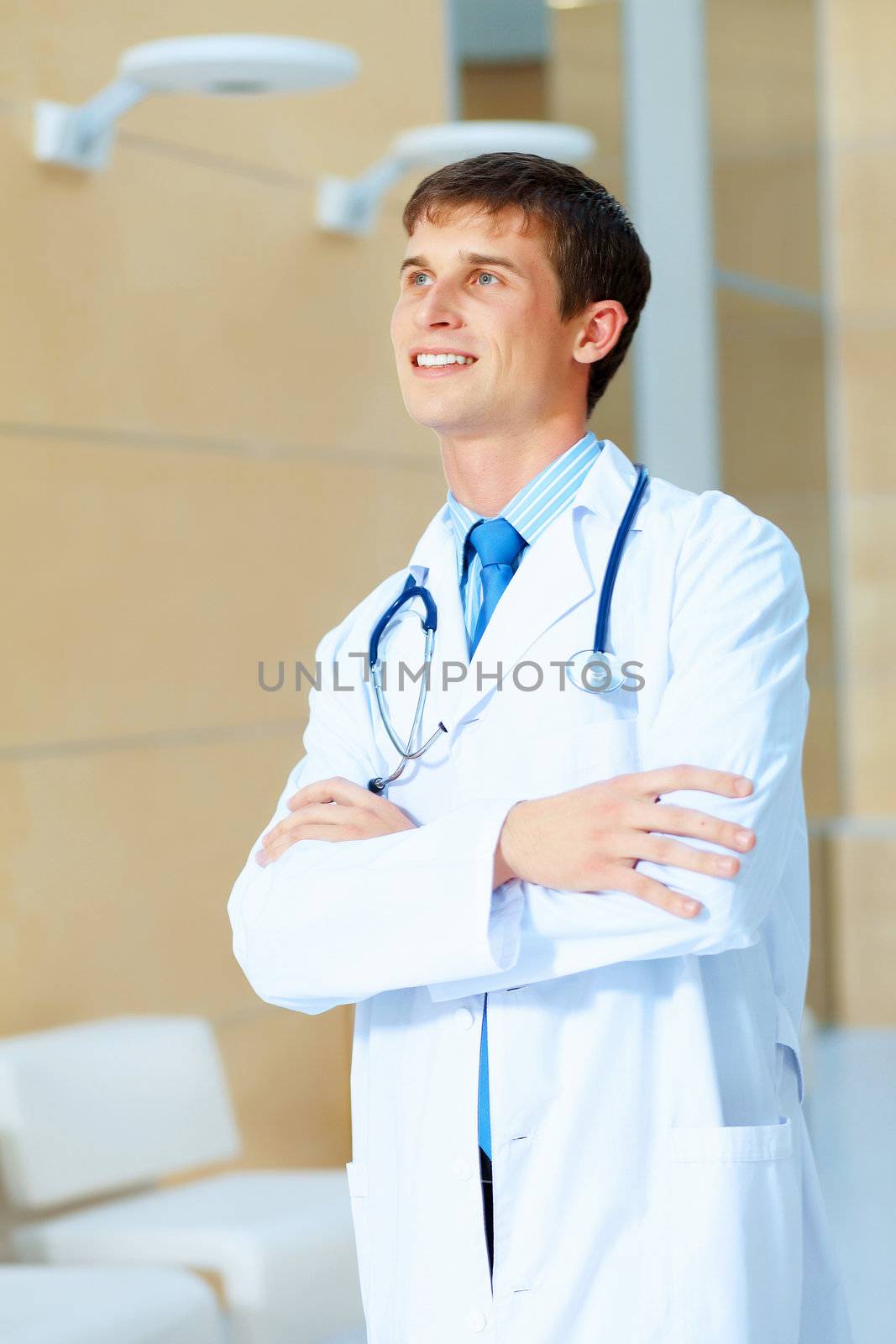 Portrait of friendly male doctor in hospital smiling