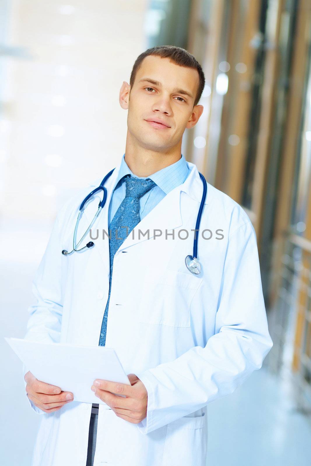 Portrait of friendly male doctor in hospital smiling