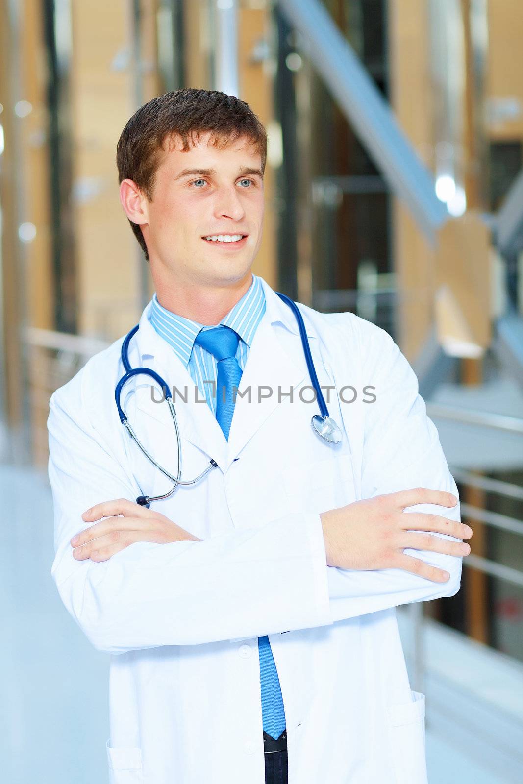 Portrait of friendly male doctor in hospital smiling