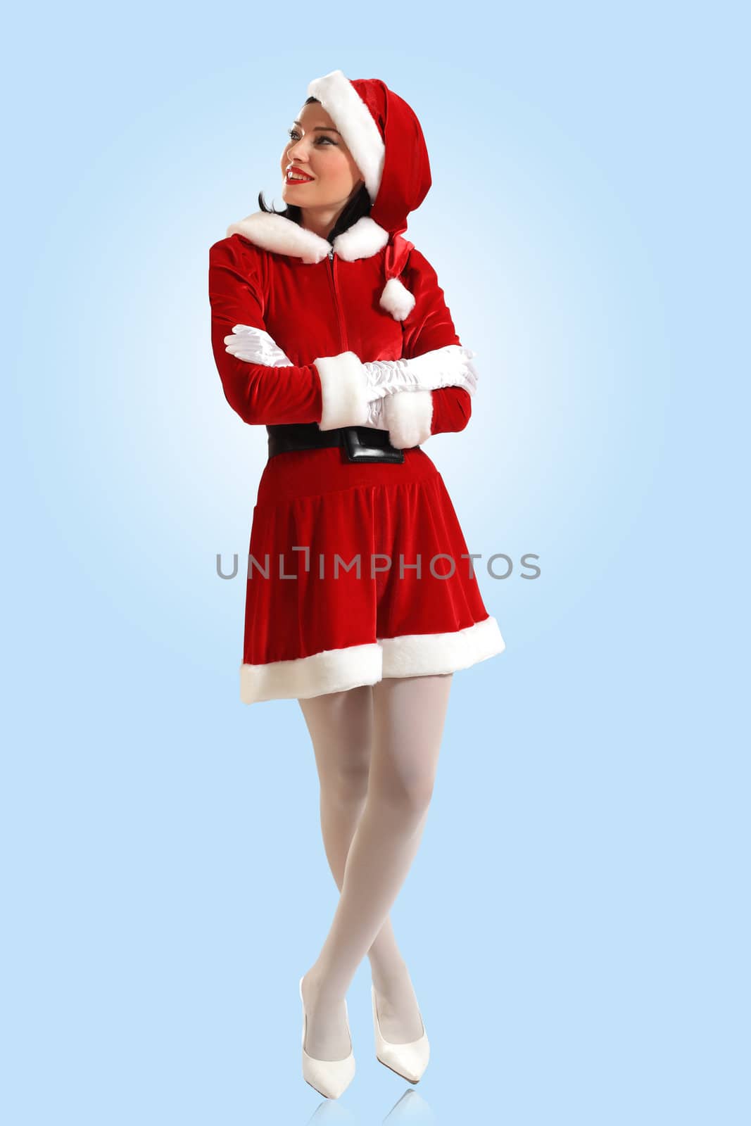 Portrait of beautiful young woman wearing santa claus clothes