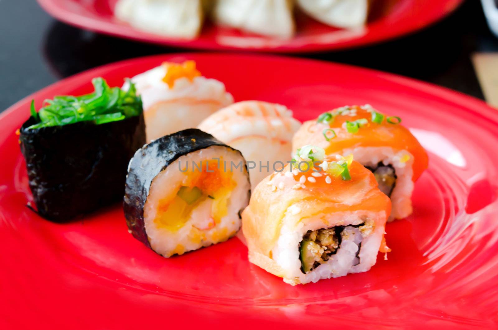 lots of various Japanese sushi and  sushi rolls