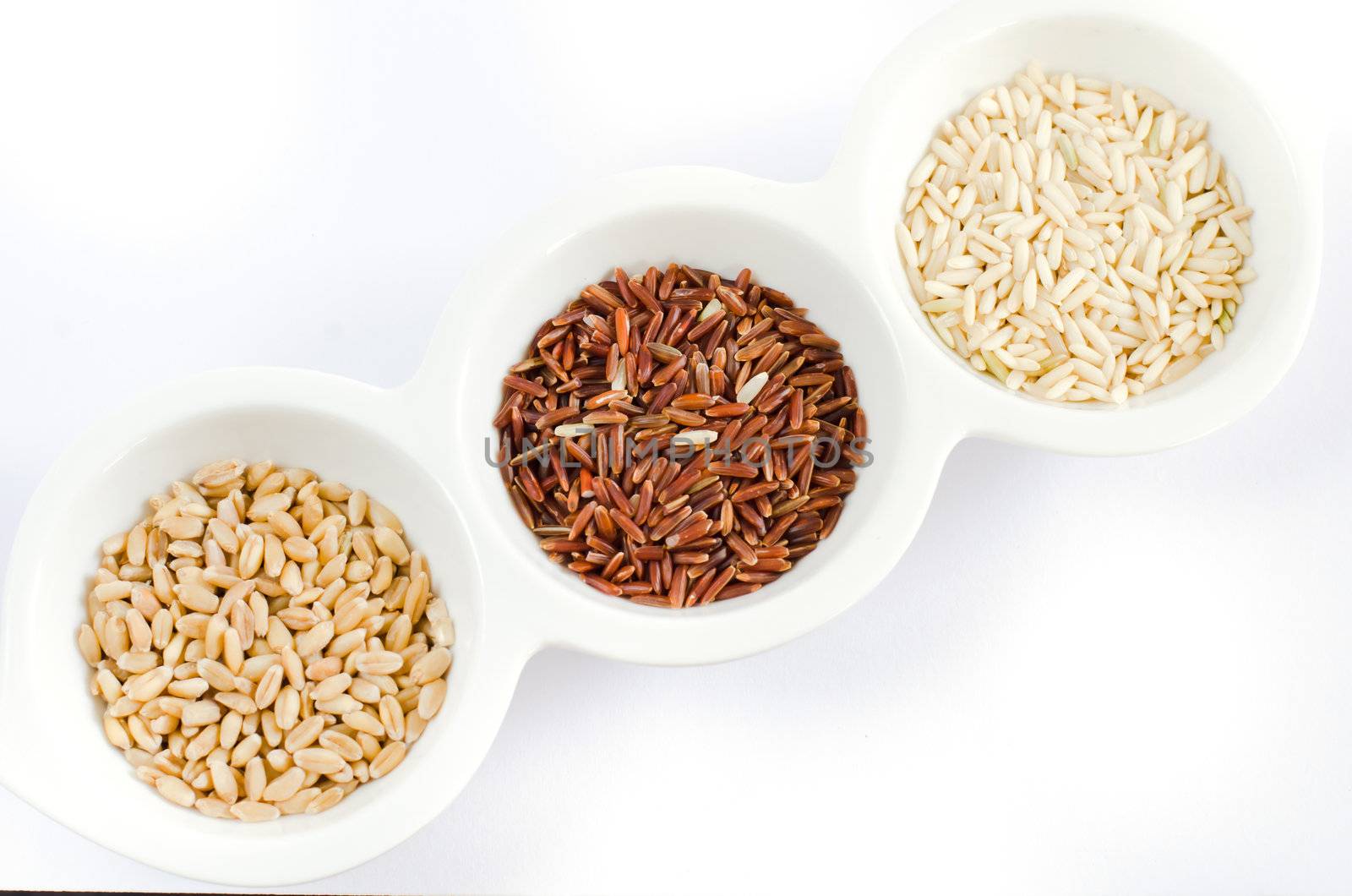  rice , red rice , wheat grains on white bowl