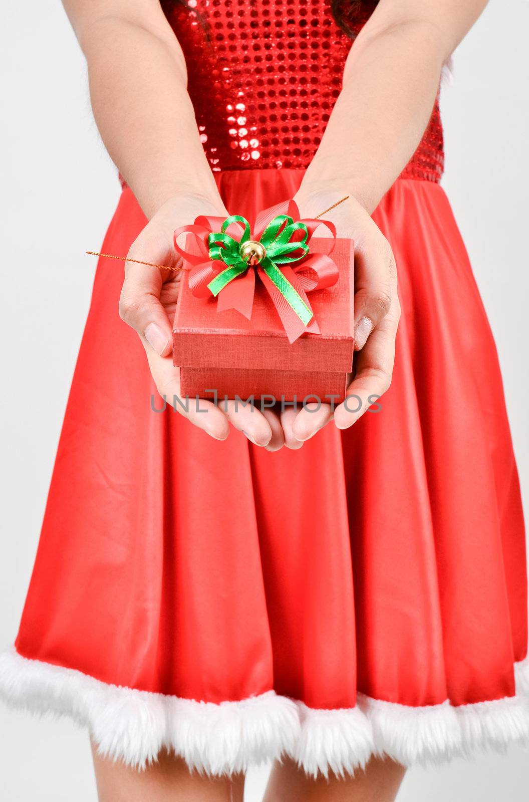 Santa woman  holding a gift box isolated on white background