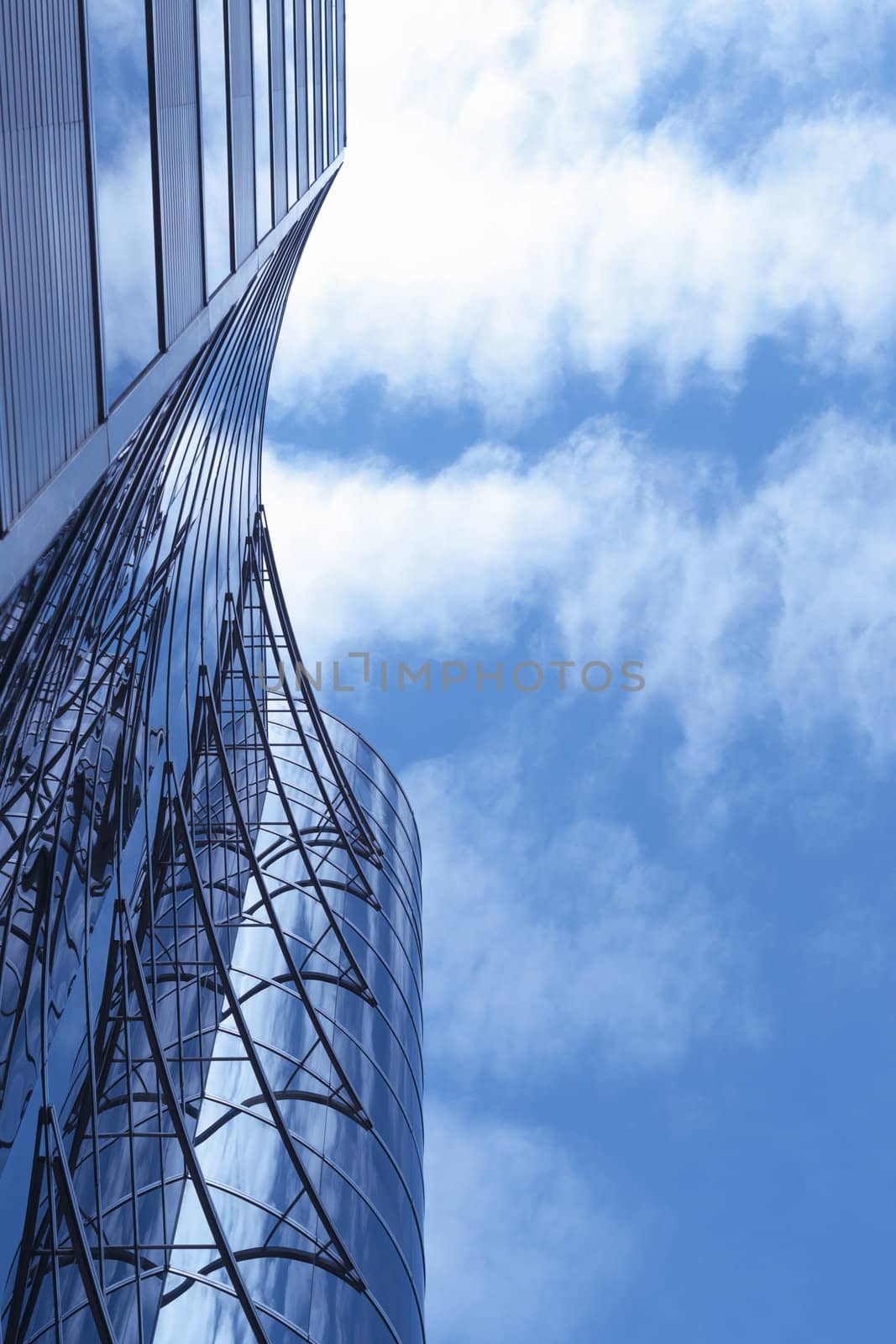 modern building view from below with cloudy blue sky