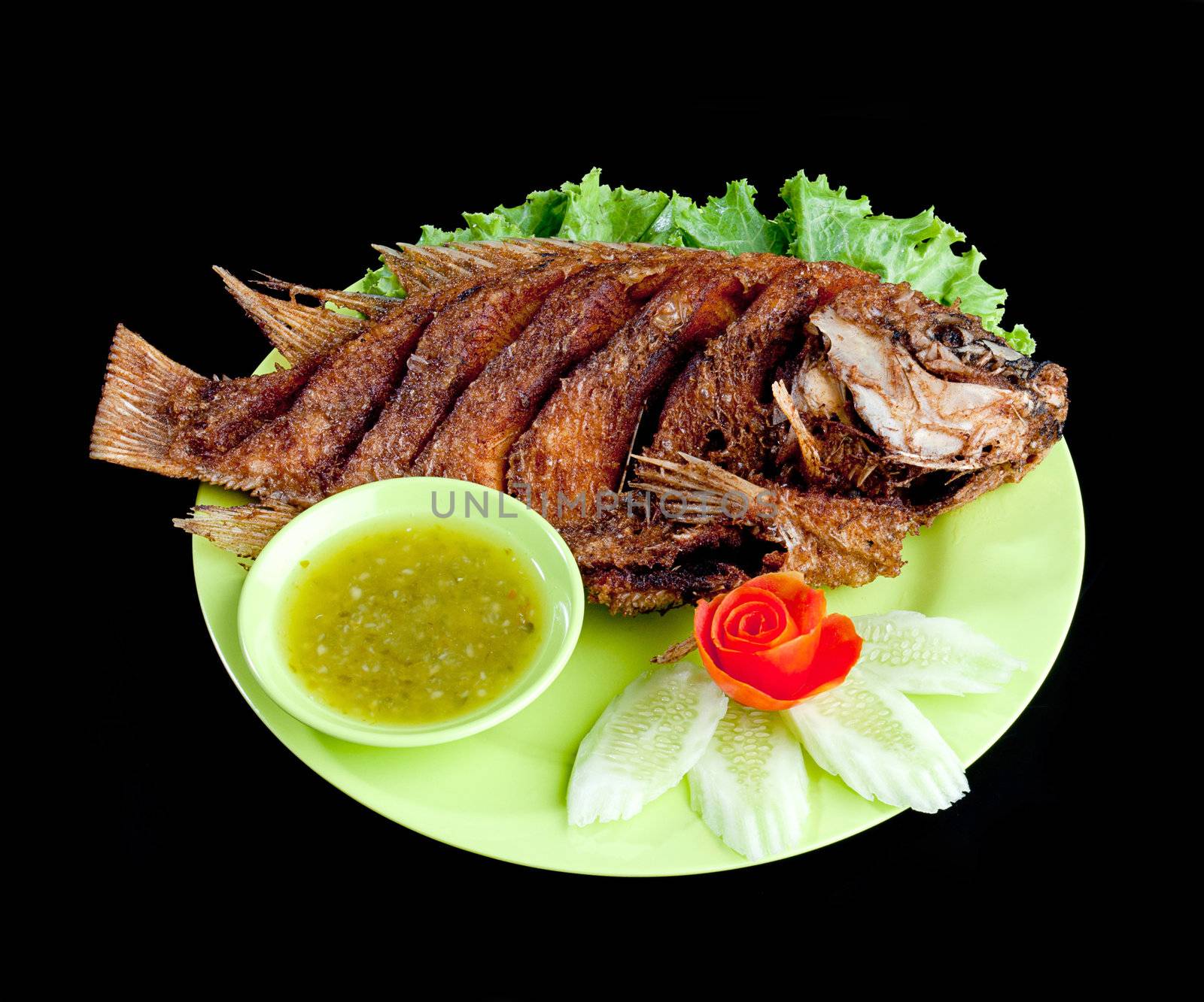 Deep freid fish seafood with sauce isolated on black background 