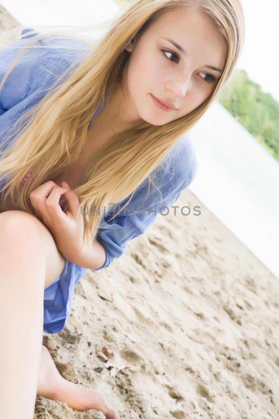 girl with long hair in the sand by DNFStyle