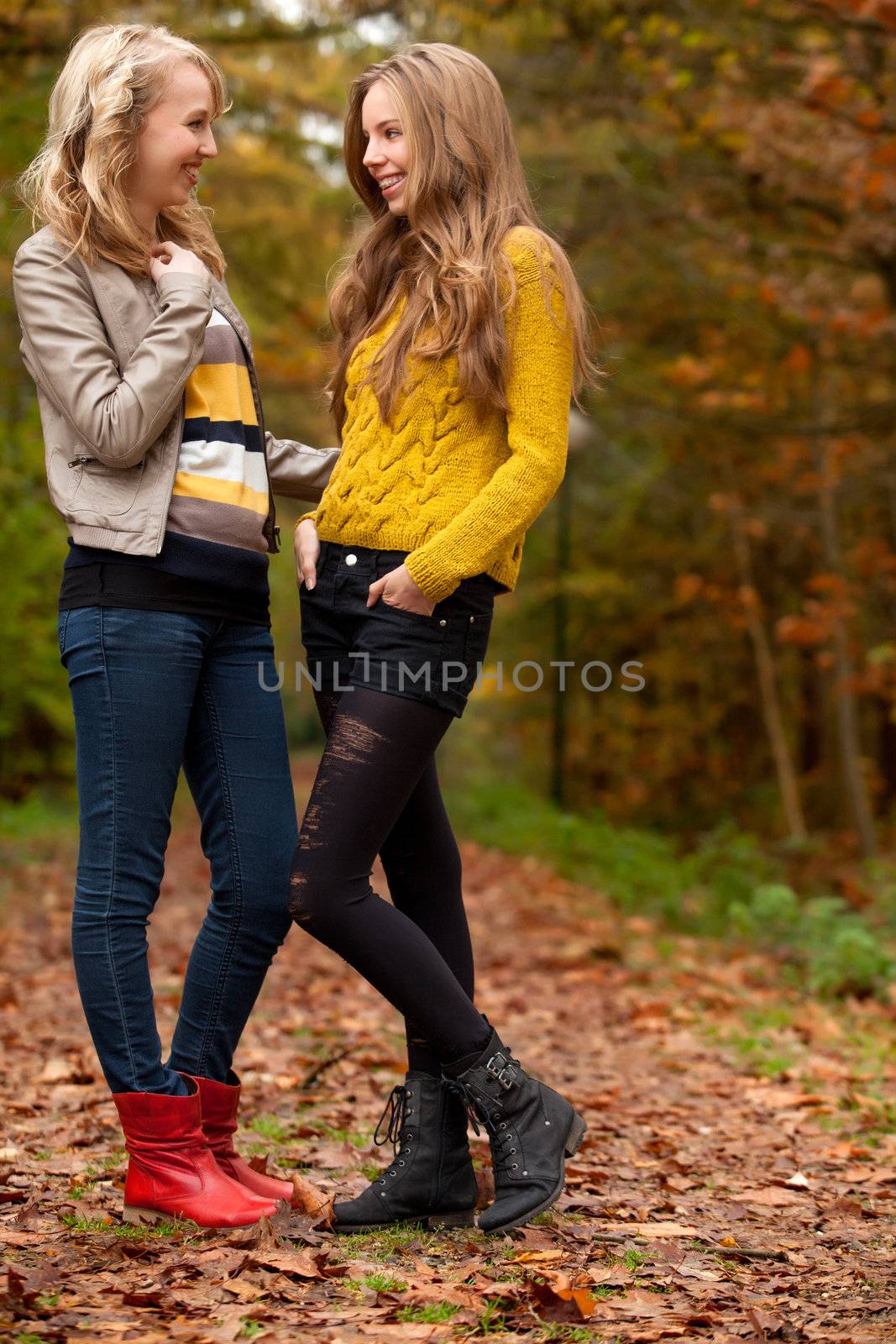 2 girls are having fun in the forest