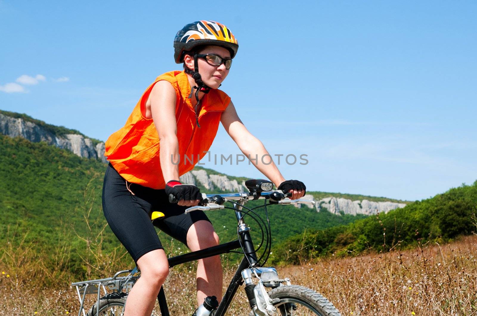 A young female riding a mountain bike outdoor