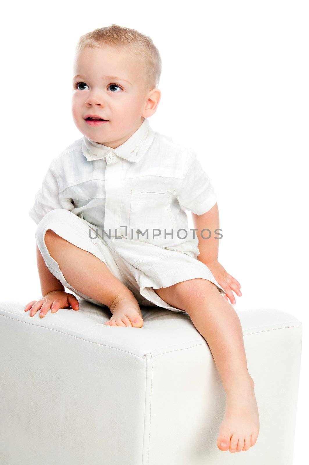 Little boy standing isolated over white background