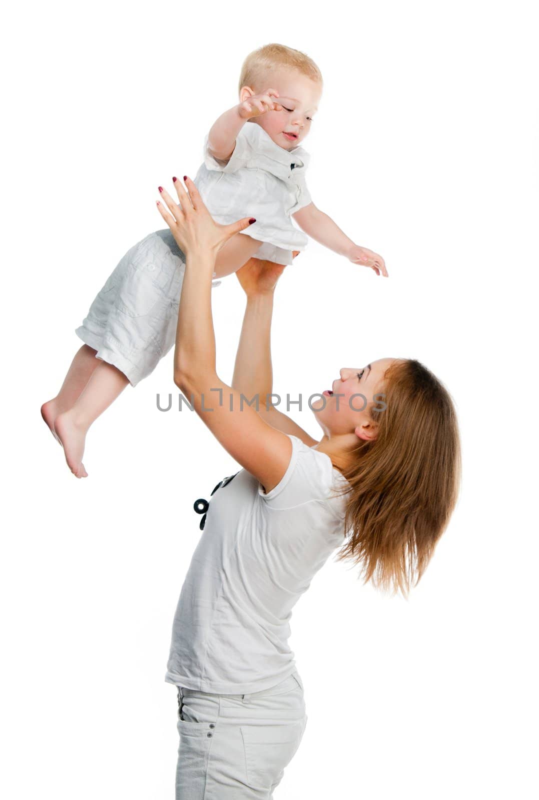 Mom raises her little boy over her head