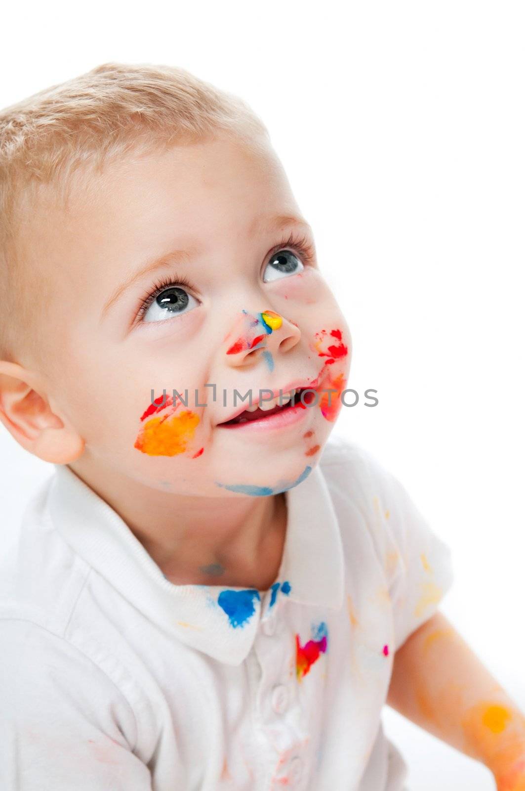 close up portrait of little boy in paint