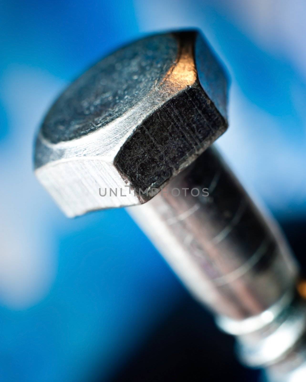 metal bolt heads with blue blur background