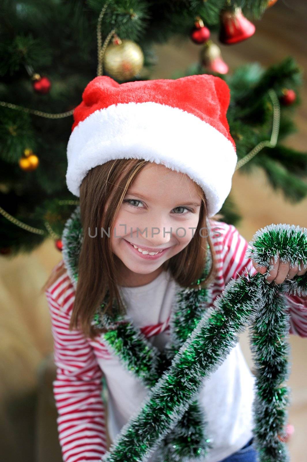 happy christmas child in santa hat closeup