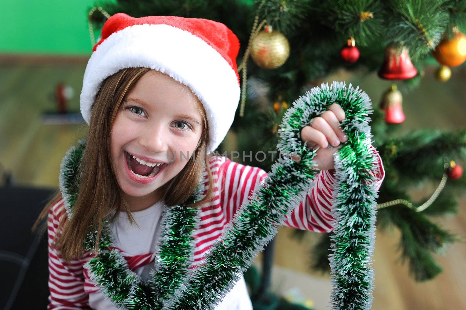 portrait of adorable happy christmas child in santa hat