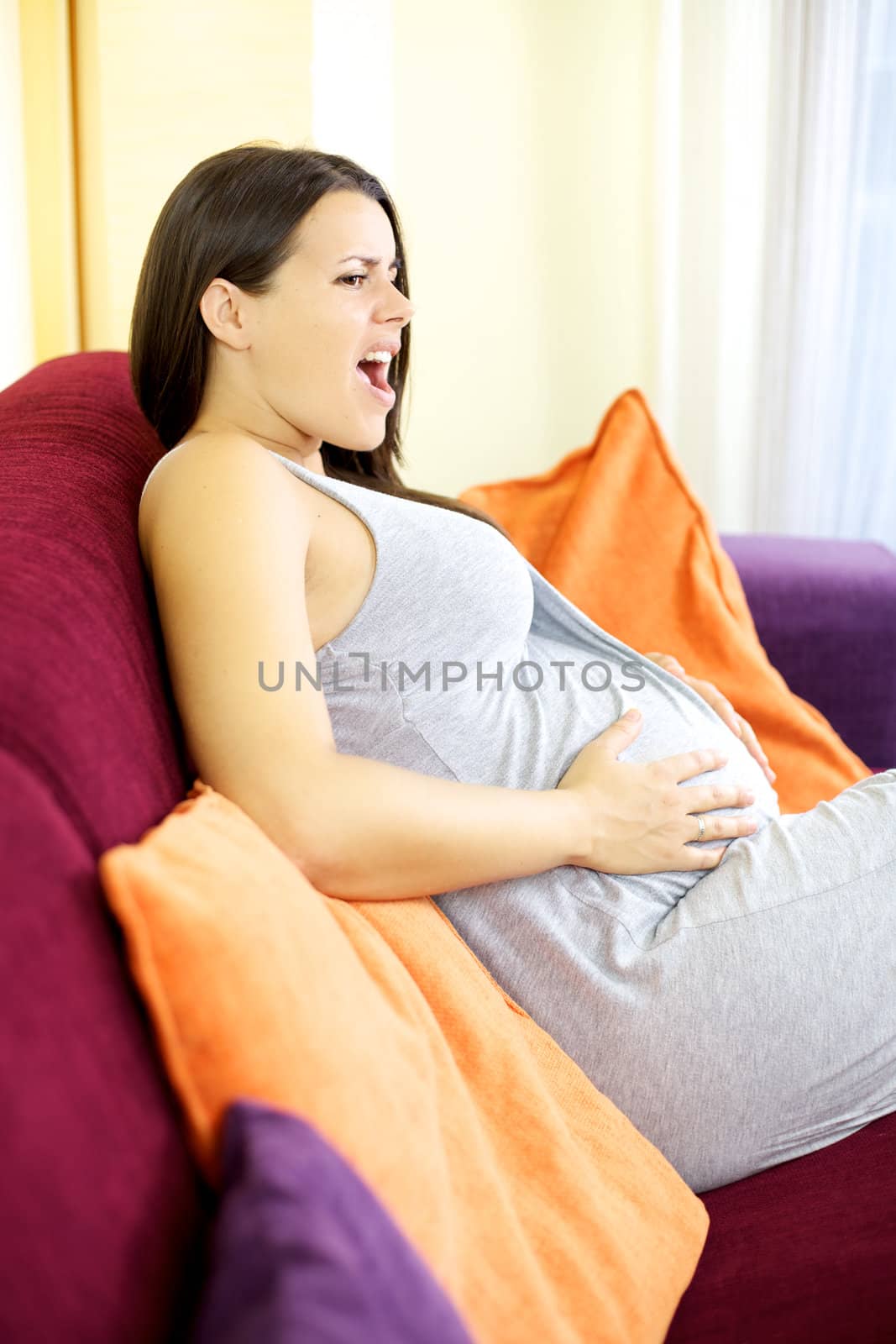 Beautiful pregnant woman ready to deliver baby suffering