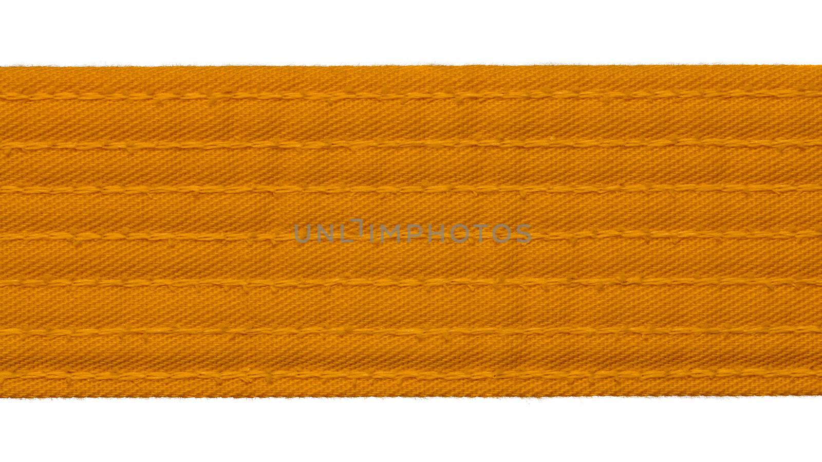Karate orange belt closeup isolated on white background