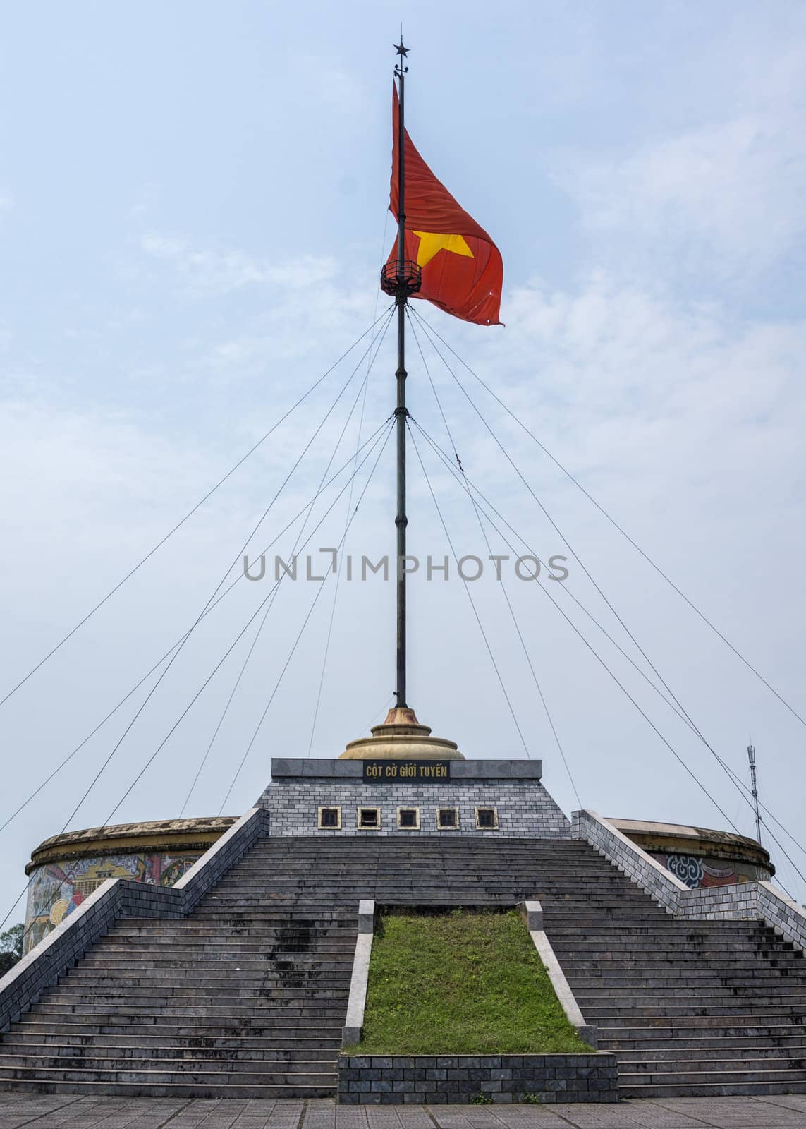 Vietnam - DMZ Cot Co flag tower against blue skies. by Claudine