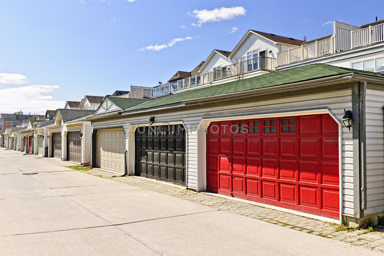 Row of garage doors at parking area for townhouses