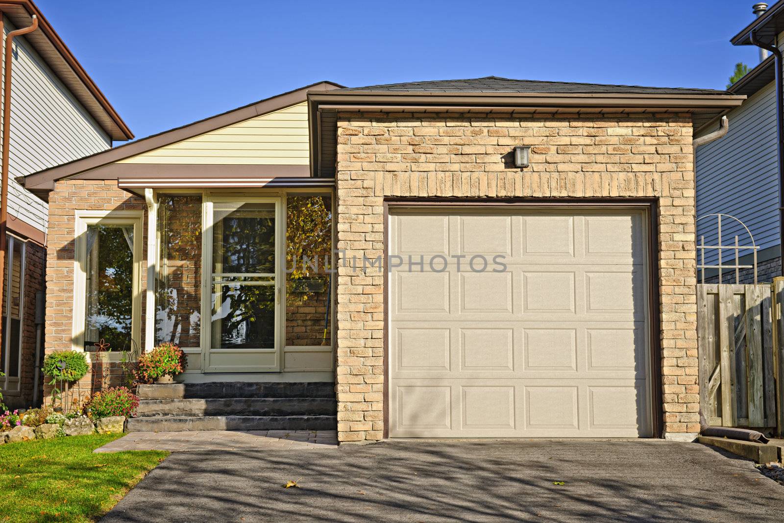 Suburban small bungalow house with single garage