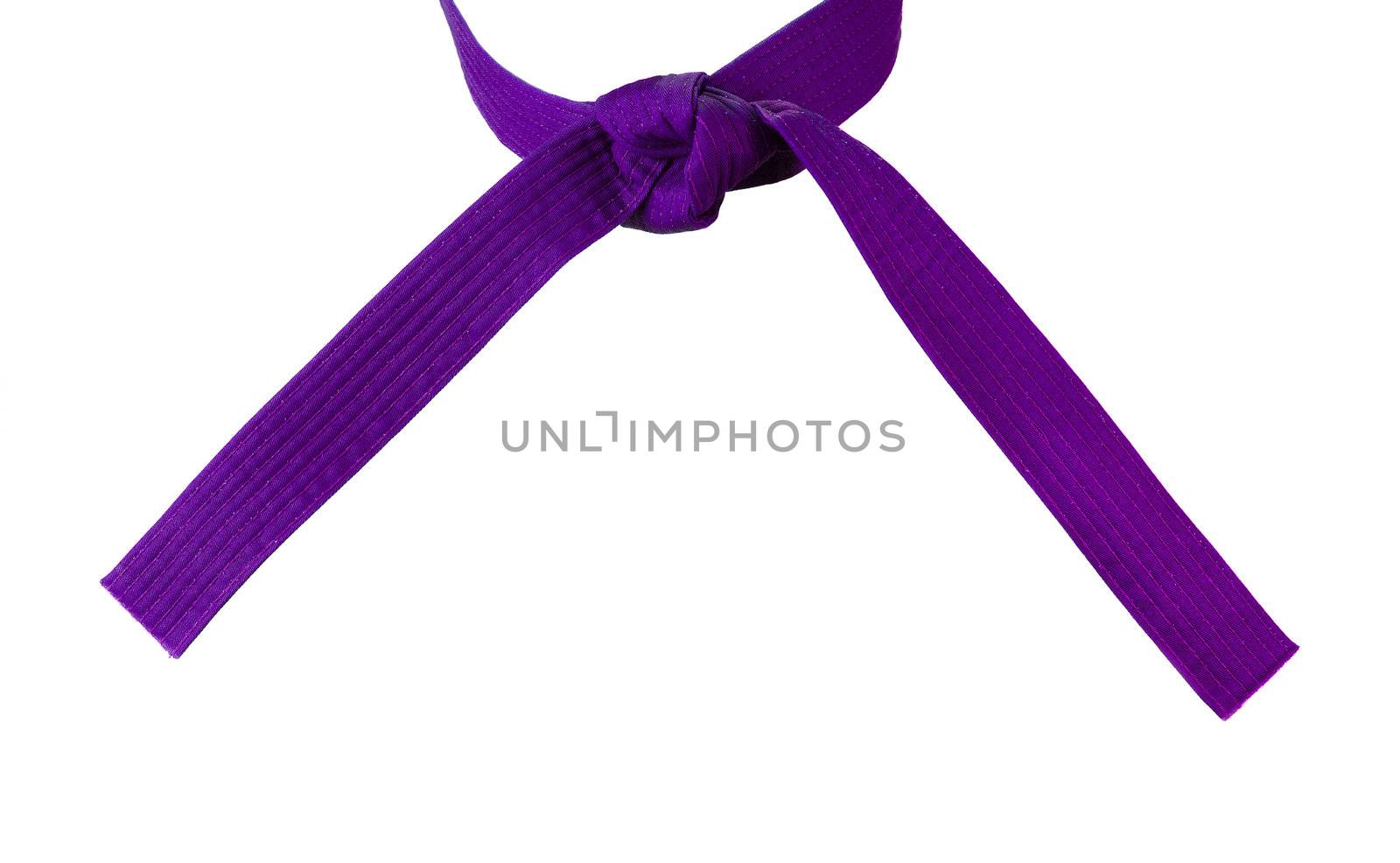 Tied Karate purple belt closeup isolated on white background