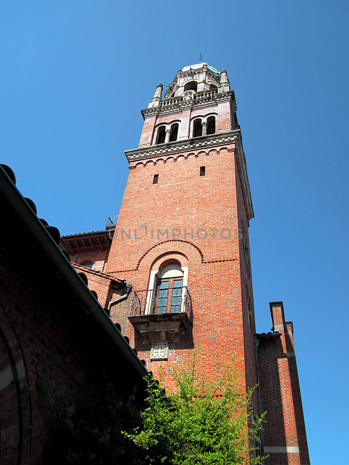 A photograph of a church bell tower detailing its unique architectural design.