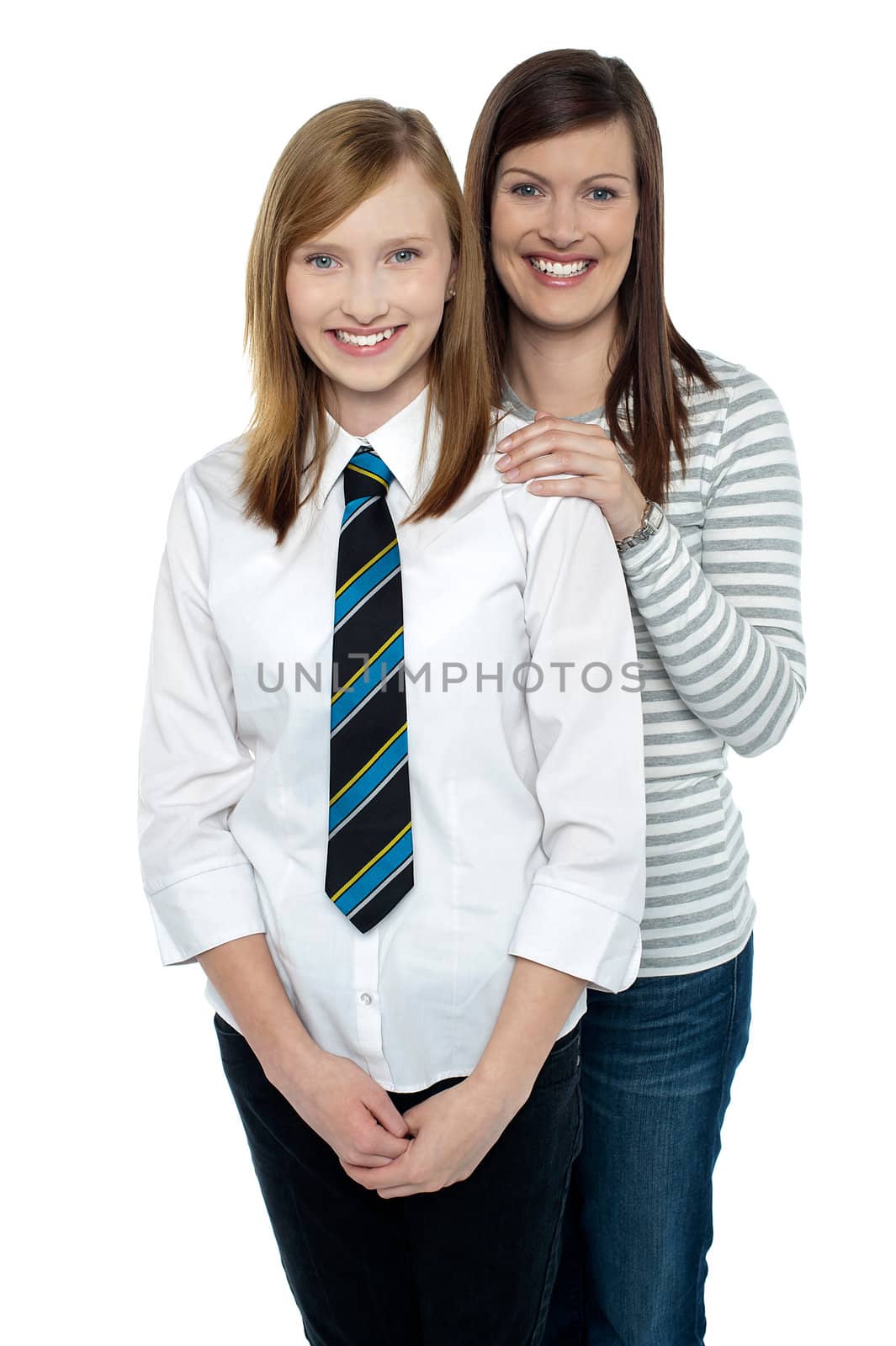 Blonde mother and daughter posing together by stockyimages