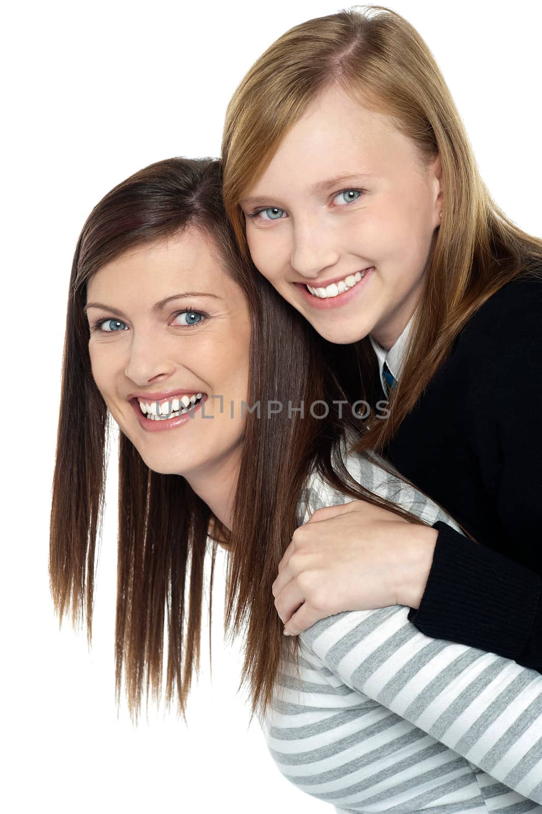 Pretty daughter enjoying a piggyback ride by stockyimages