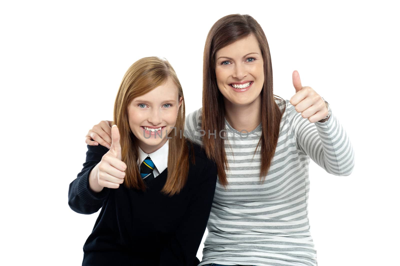 Charming daughter with her mother showing thumbs up sign to the camera.