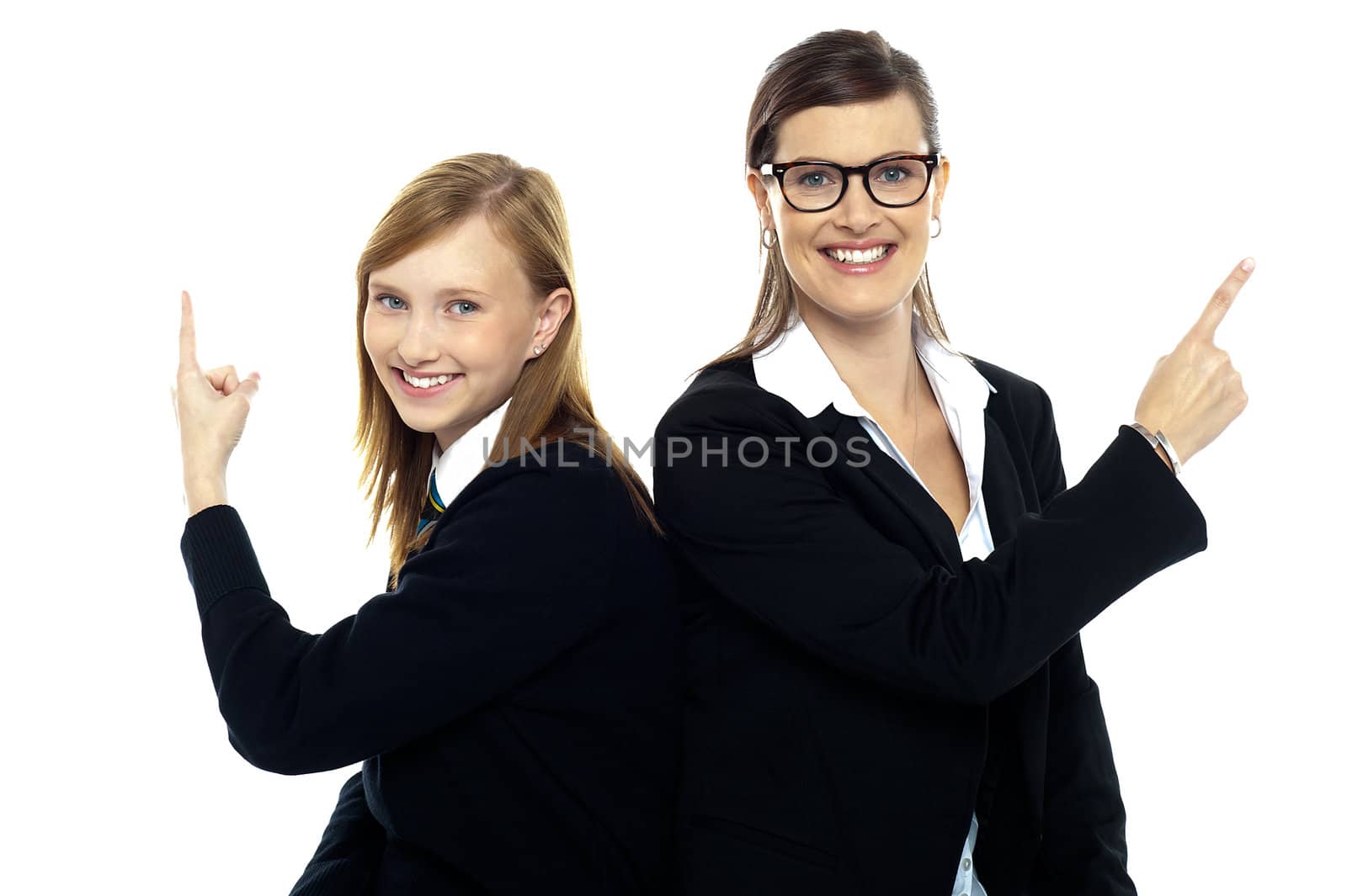 Student with teacher, back to back. Pointing away by stockyimages