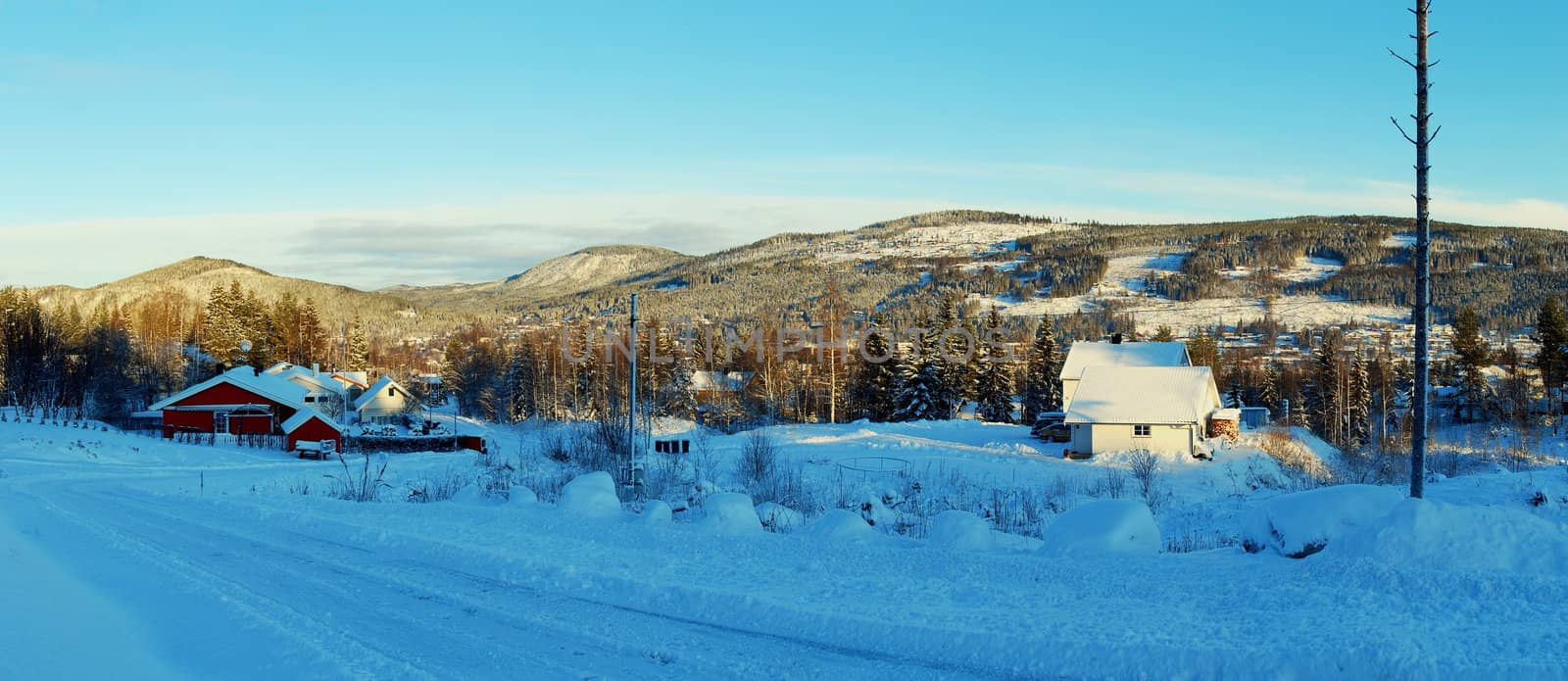 Snowy winter. Houses in mountains, forests in Trysil.