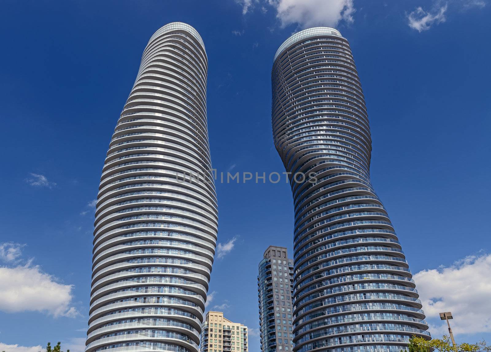 The Absolute World condominium Towers in the city center of Mississauga Ontario on a sunny afternoon. The hourglass shaped tower has been nicknamed the Marilyn Monroe tower due to the curvy shape. 