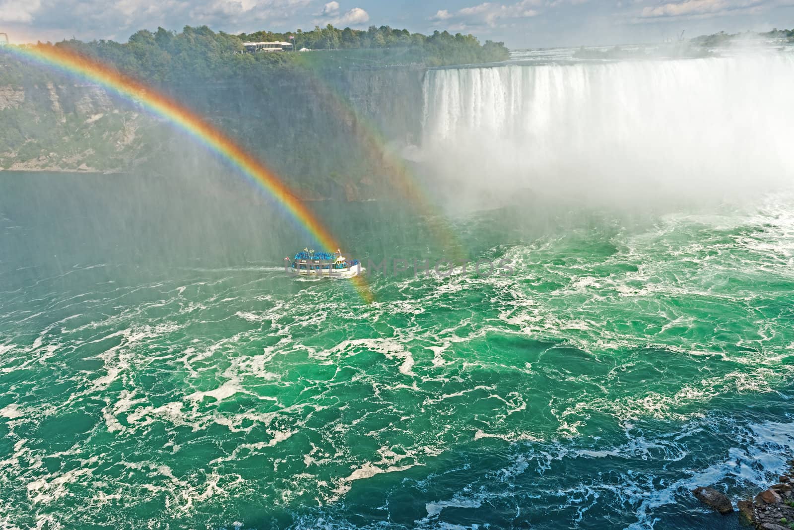 Rainbow rises from the mist at Horseshoe, Niagara Falls, Ontario, Canada