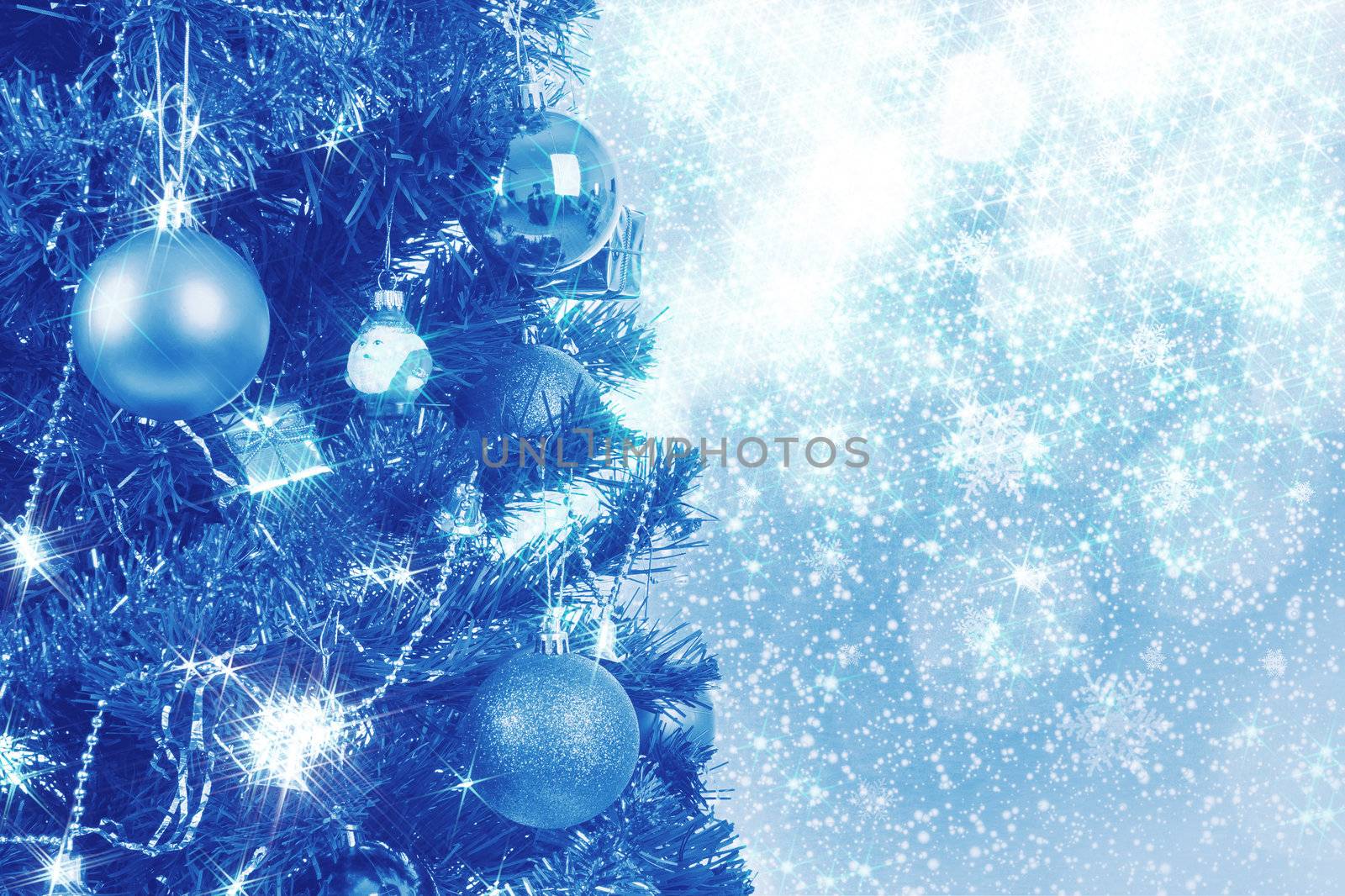 blue christmas background with balls on tree and snowflakes