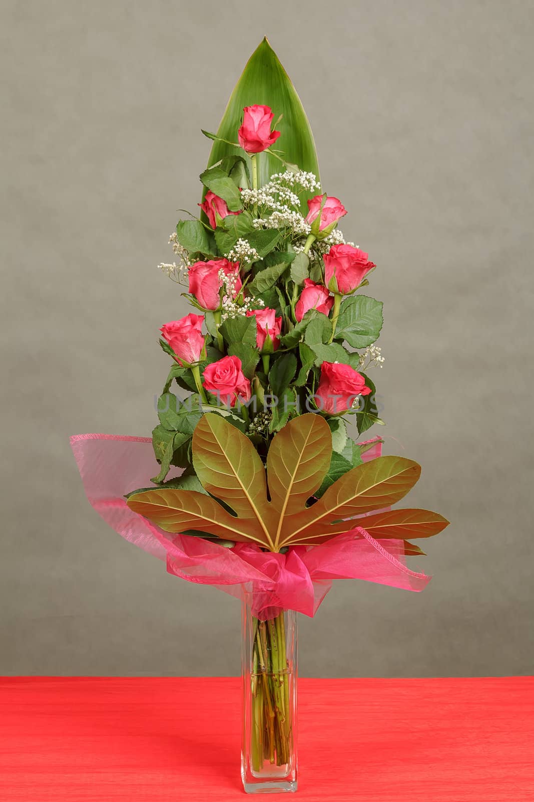 bouquet of eleven red roses in vase 