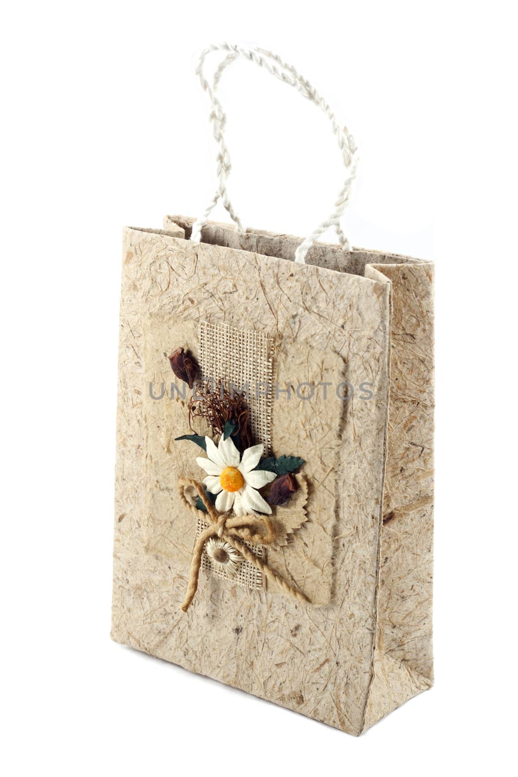Brown mulberry paper bag isolated with flower.