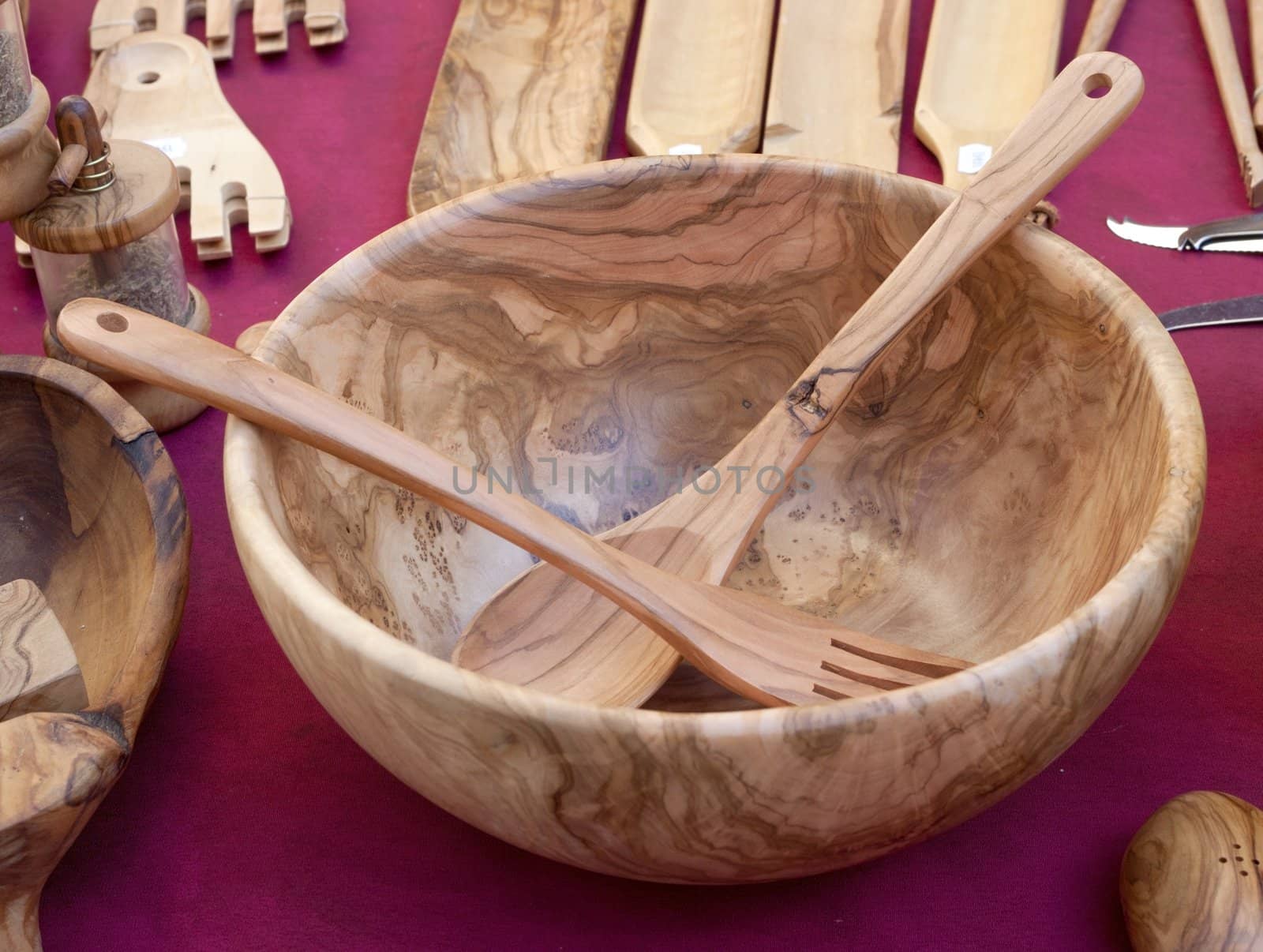 Wooden Bowl with fork and spoon in the market, France.