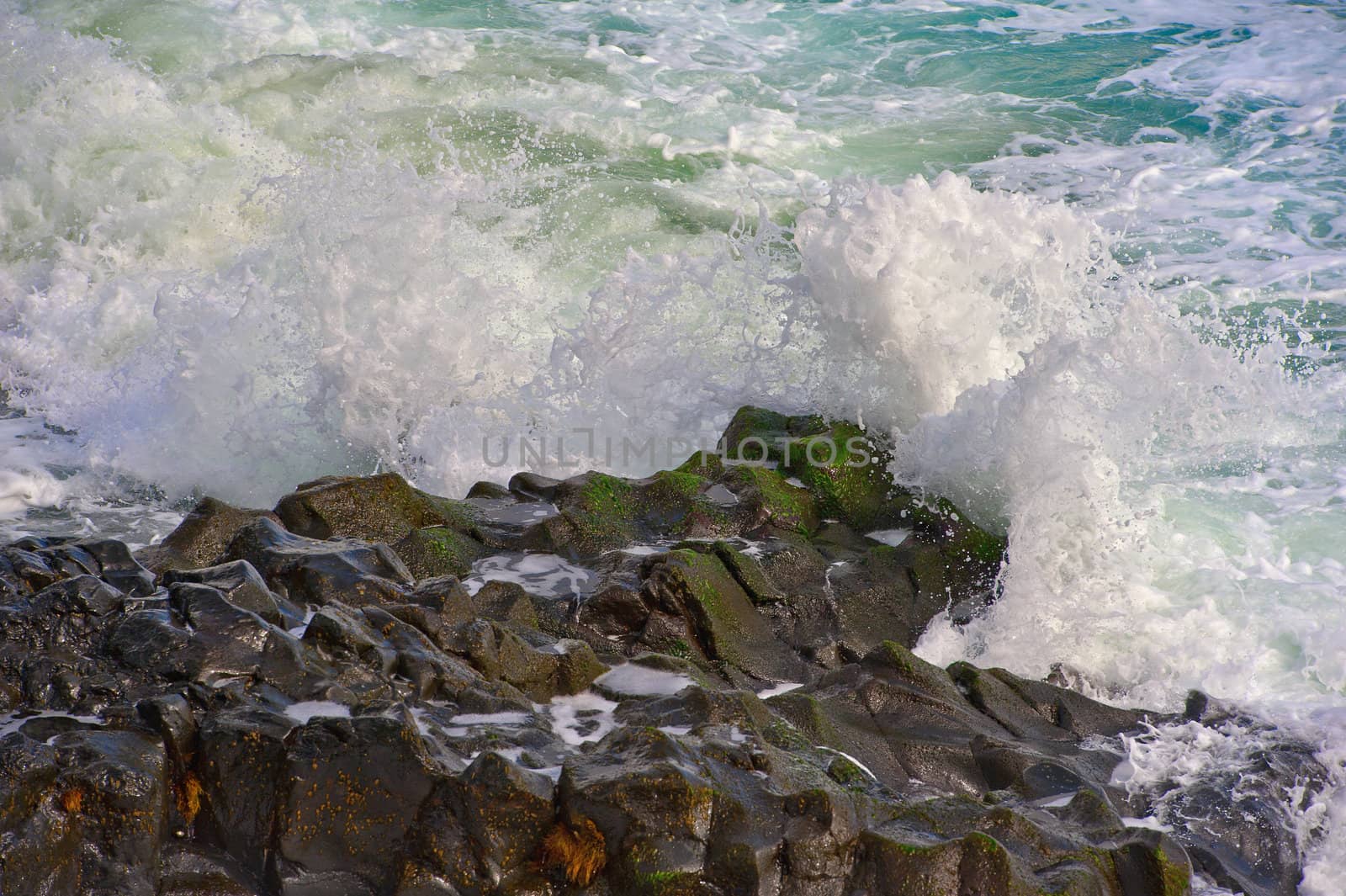 Breaking waves Against The Rocky Shore Of Maui, Hawaii Islands, USA
