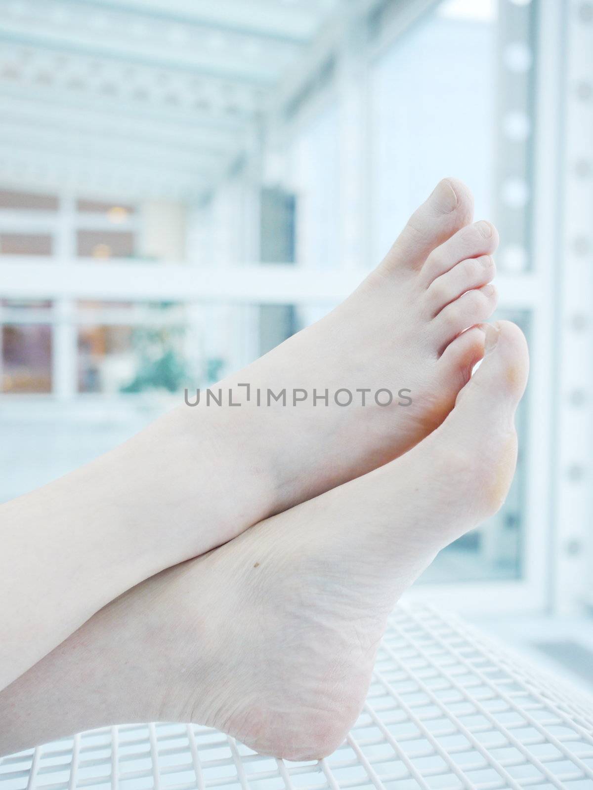 woman holding sore knee, isolated on white