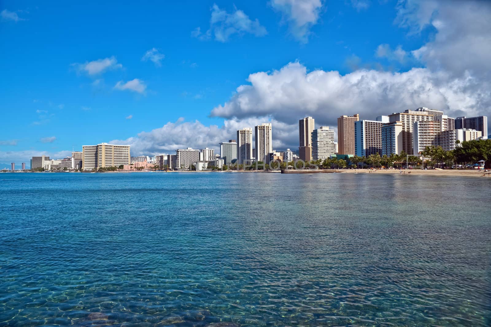 Cityscape Waikiki Beach, Honolulu Hawaii, USA.  Waikiki beach is a popular spot in the city of Honolulu to swim, surf, and relax