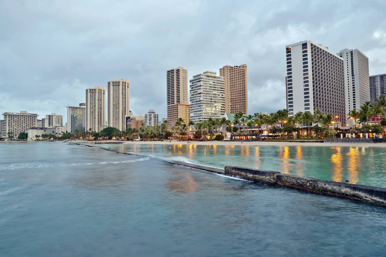 Cityscape Waikiki Beach, Honolulu Hawaii, USA.  Waikiki beach is a popular spot in the city of Honolulu to swim, surf, and relax