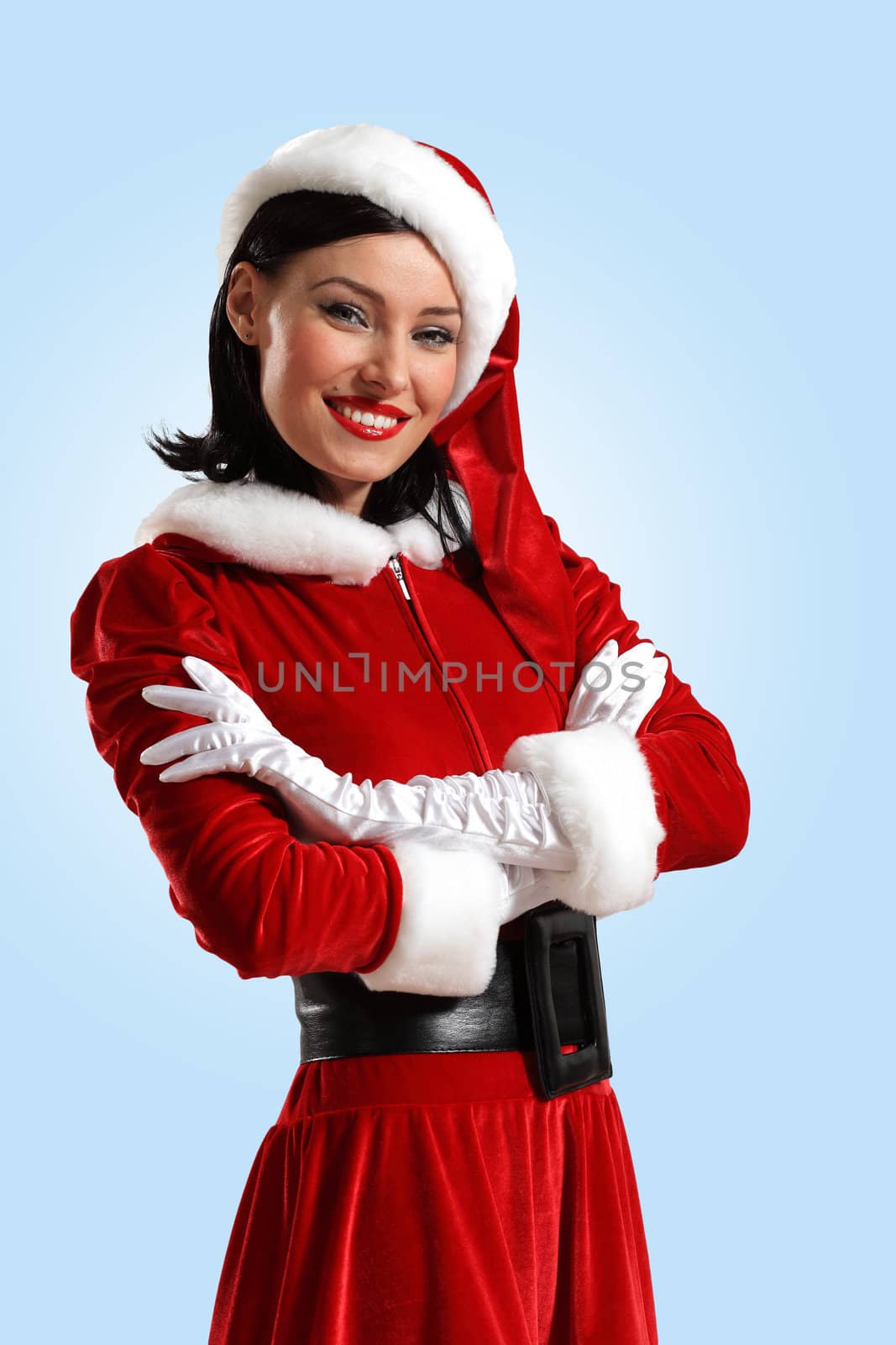 Portrait of beautiful young woman wearing santa claus clothes