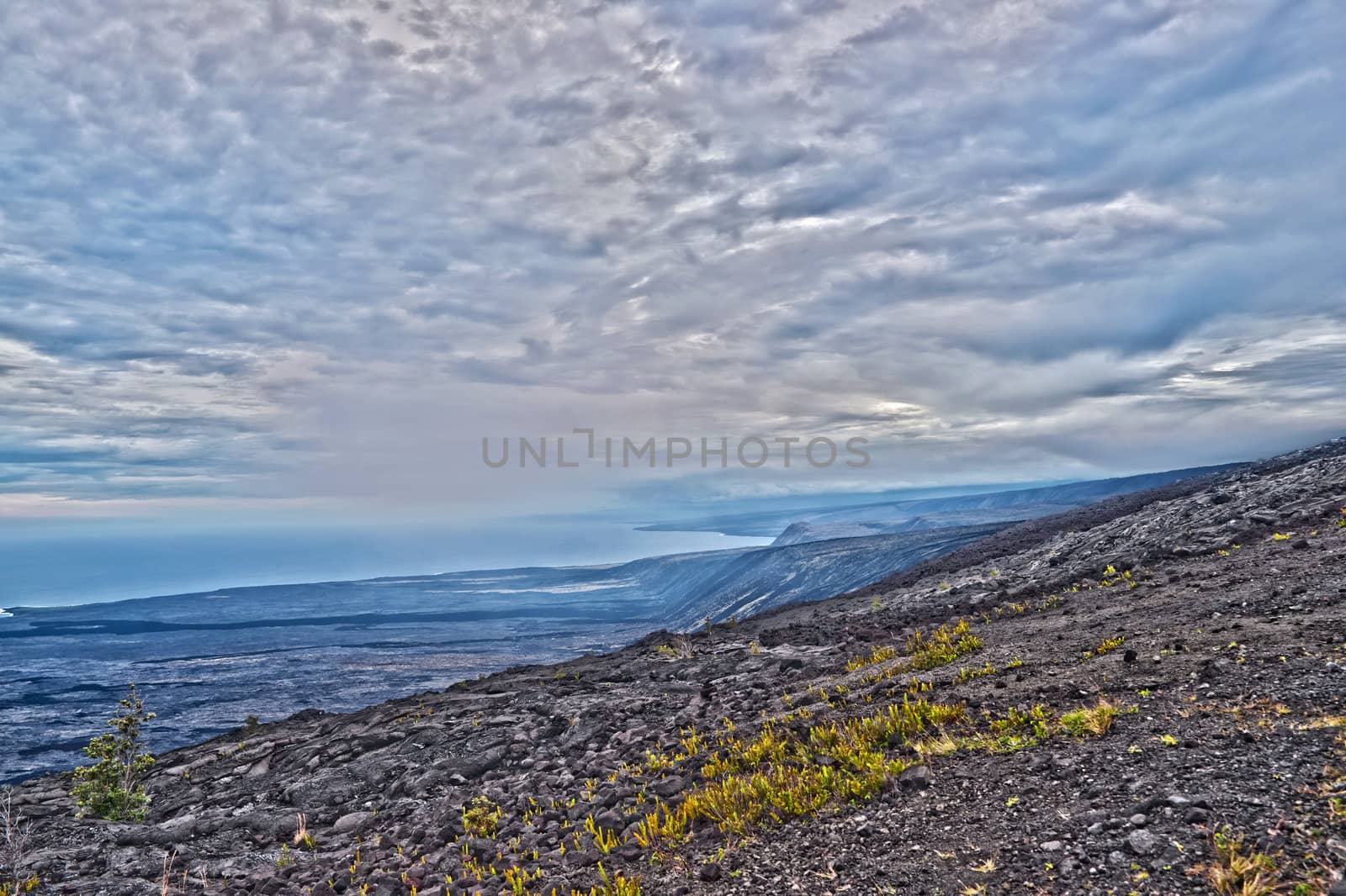 Solidified Cracked Lava Flow in Volcano, volcanic landscape when driving Chain of craters road in Big Island Hawaii. HDR image.