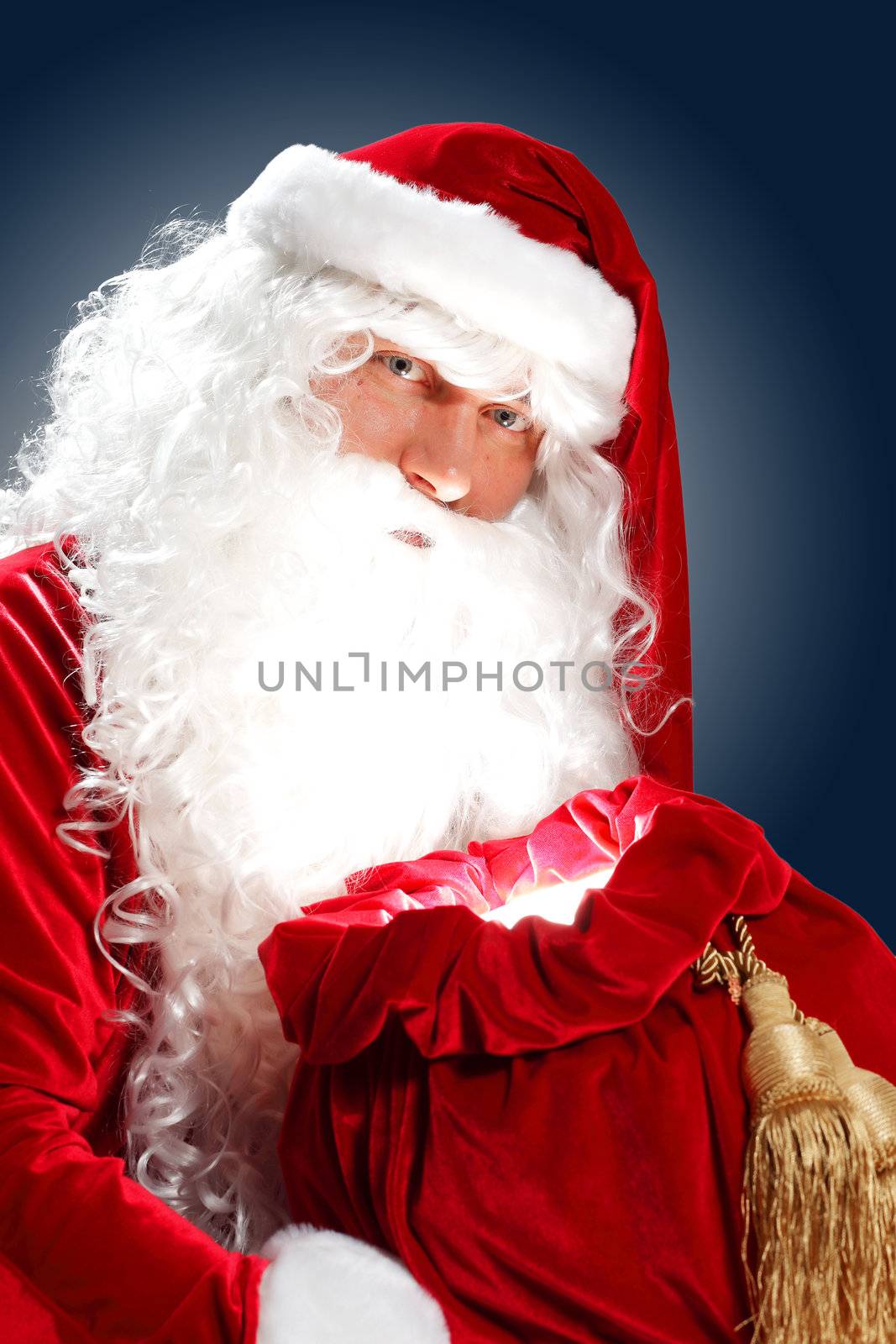 Santa Claus with his magic gift red bag full of presents