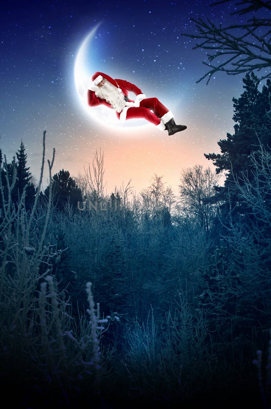 Photo of Santa Claus sitting on shiny moon above winter forest