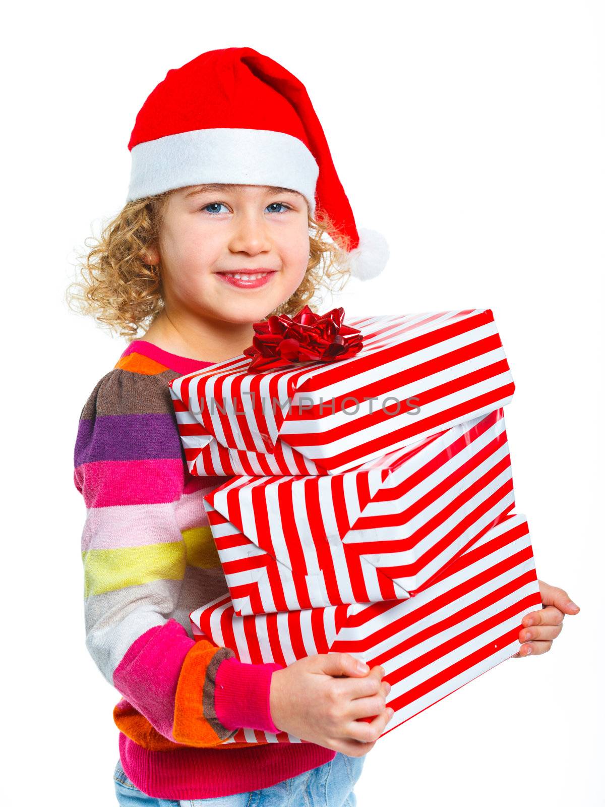Smiling little girl in Santa's hat with gift box, isolated on white