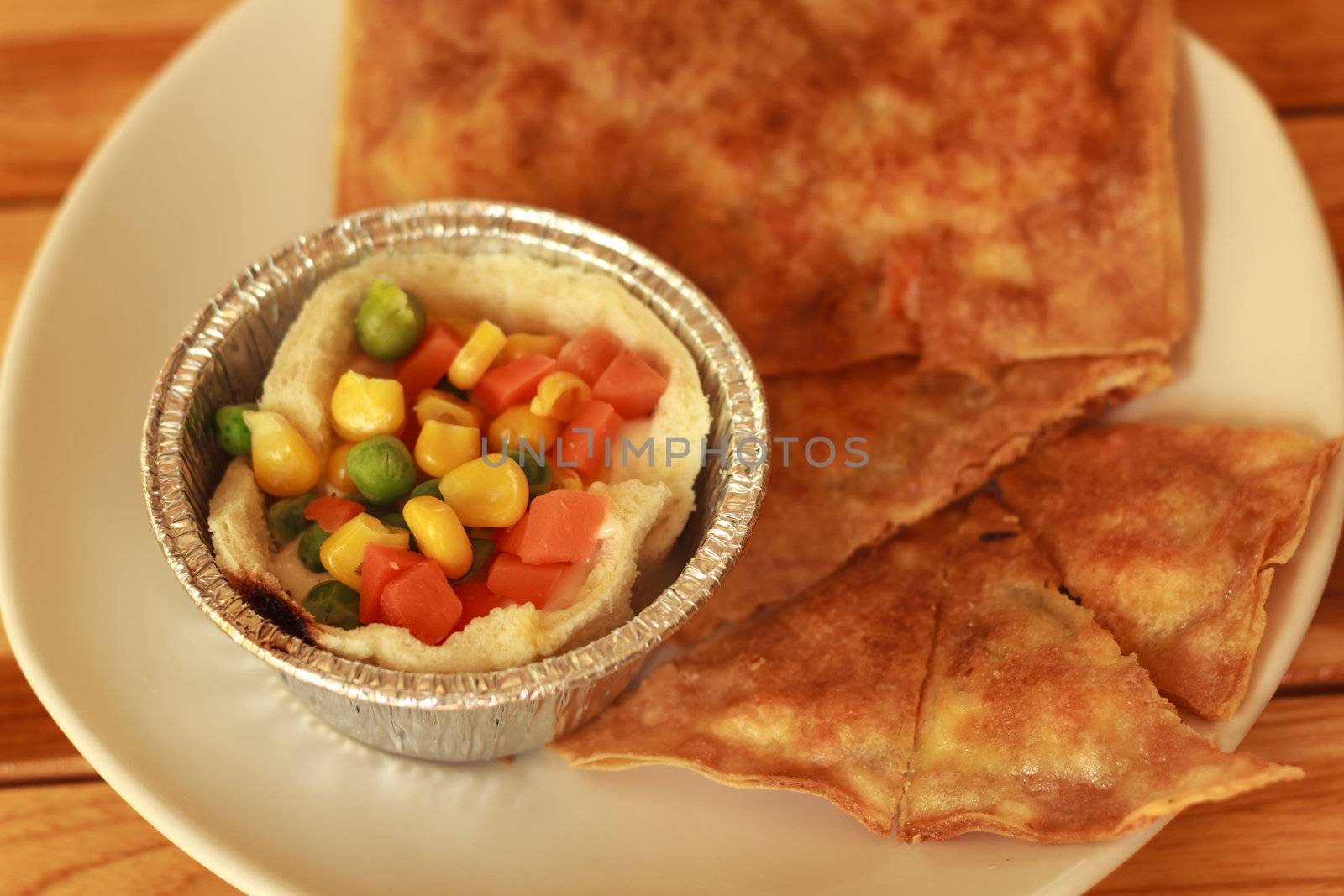 southern flat bread or crispy roti and breakfast on white plate
