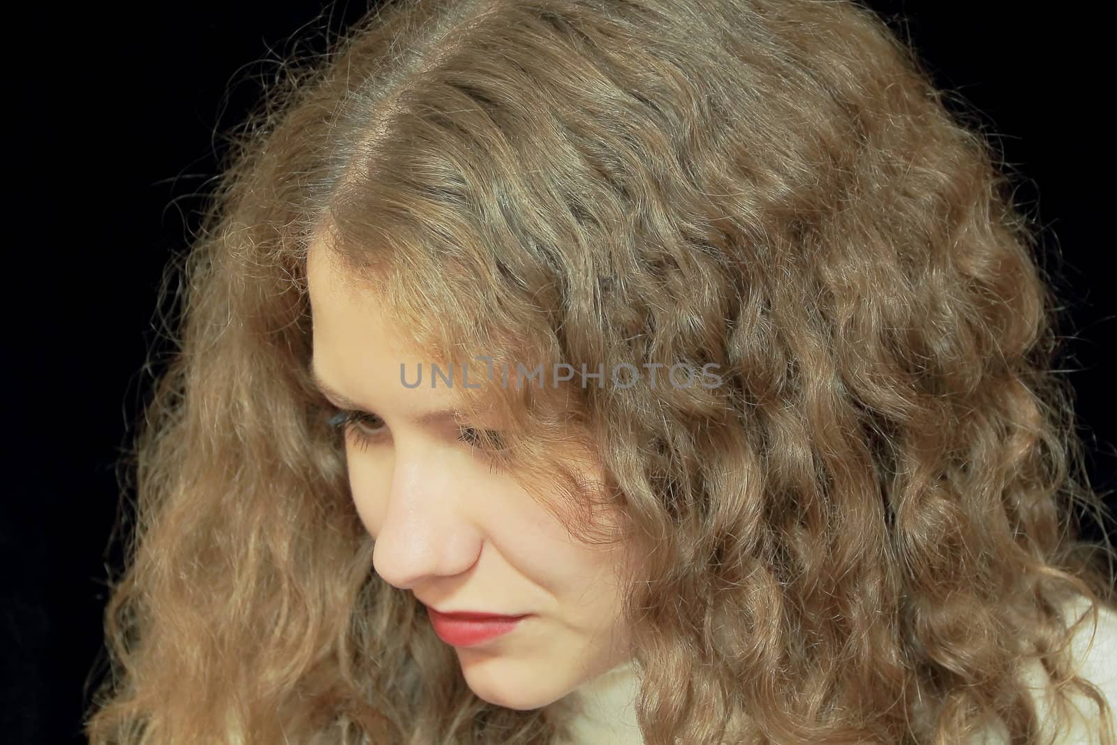 Portrait of young woman with long brown nature hair